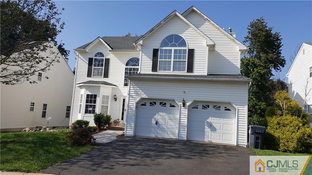 67 Shaffer Road Bridgewater, NJ 08807 - Photo 2 of 25 a front view of a house with a yard
