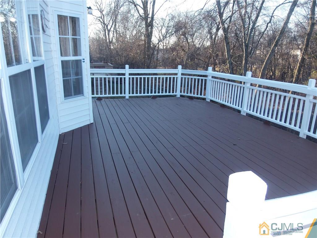 67 Shaffer Road Bridgewater, NJ 08807 - Photo 11 of 25 a balcony with wooden floor