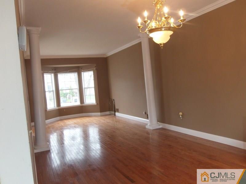 67 Shaffer Road Bridgewater, NJ 08807 - Photo 13 of 25 a view of an empty room with a window and wooden floor