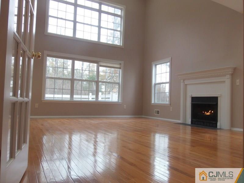 67 Shaffer Road Bridgewater, NJ 08807 - Photo 16 of 25 wooden floor fireplace and windows in an empty room
