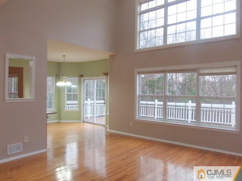 67 Shaffer Road Bridgewater, NJ 08807 - Photo 20 of 25 a view of an empty room with wooden floor and a window