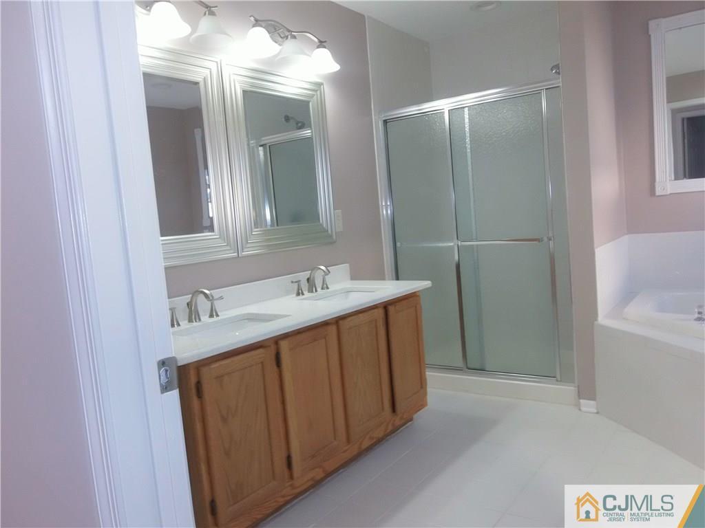 67 Shaffer Road Bridgewater, NJ 08807 - Photo 7 of 25 a bathroom with a double vanity sink and a mirror