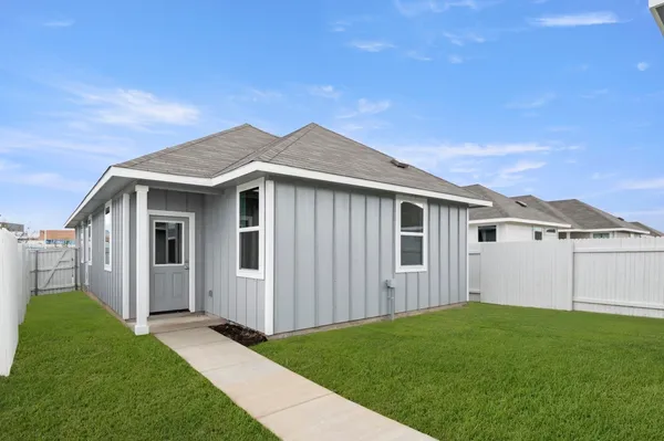 a view of garage and yard