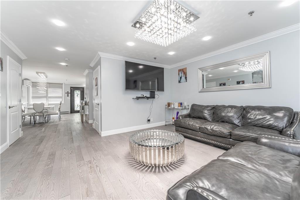 724 Egan Street Brooklyn, NY 11239 - Photo 7 of 10 a living room with furniture and a flat screen tv