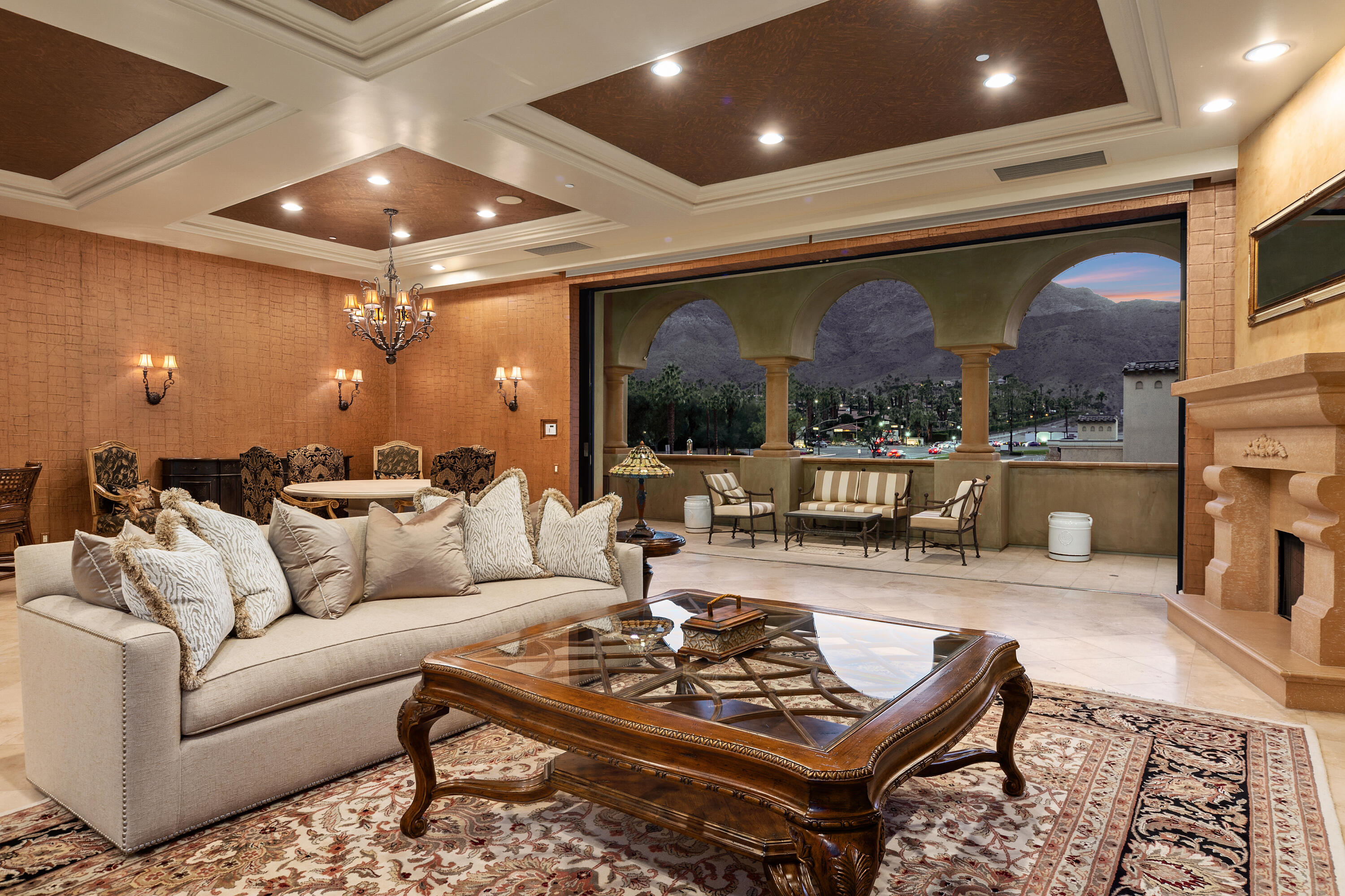 217 Via Veneto Rancho Mirage, CA 92270 - Photo 1 of 66 a living room with furniture a chandelier and a large window