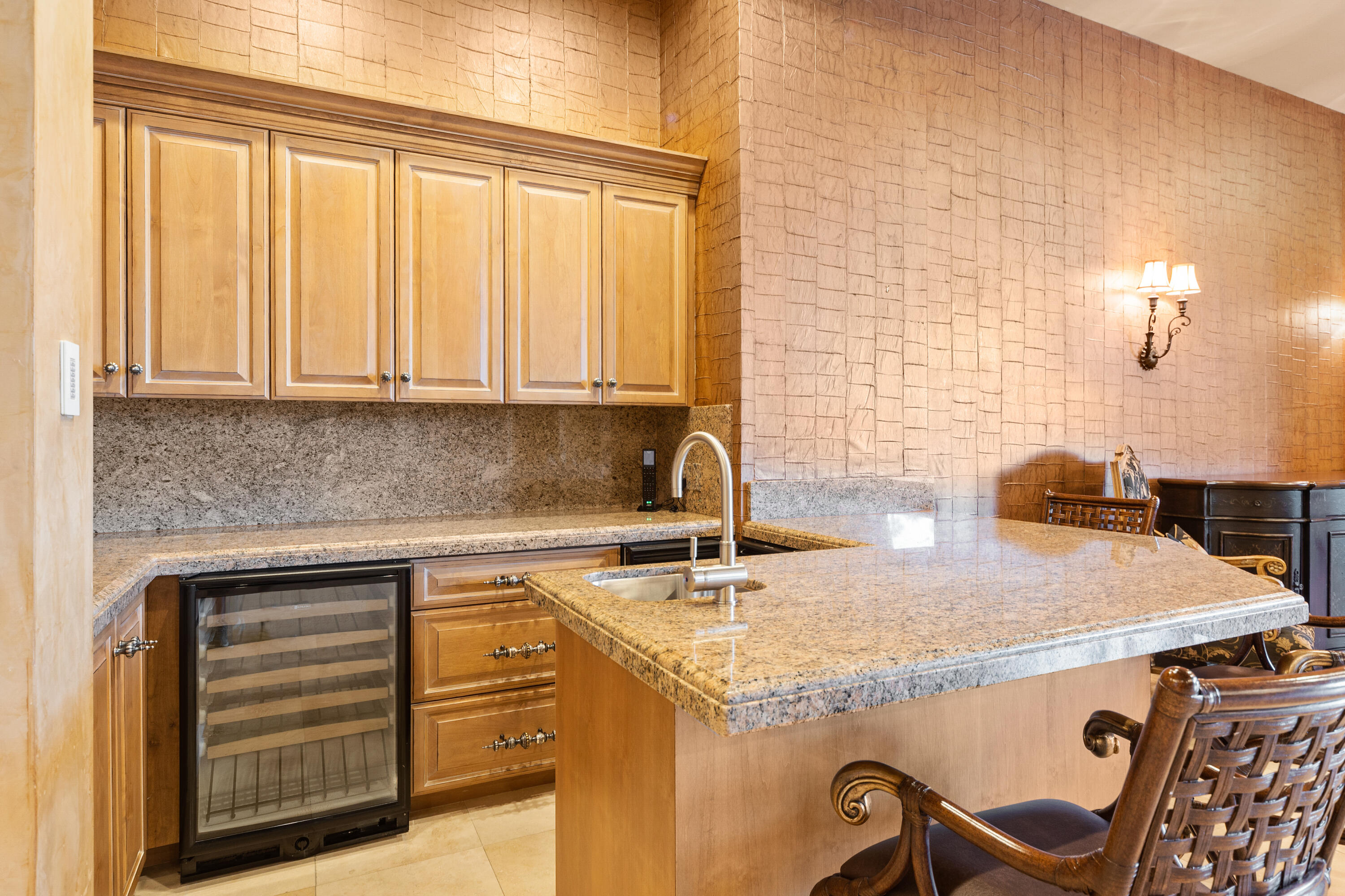 217 Via Veneto Rancho Mirage, CA 92270 - Photo 19 of 66 a kitchen with granite countertop a sink a stove and cabinets