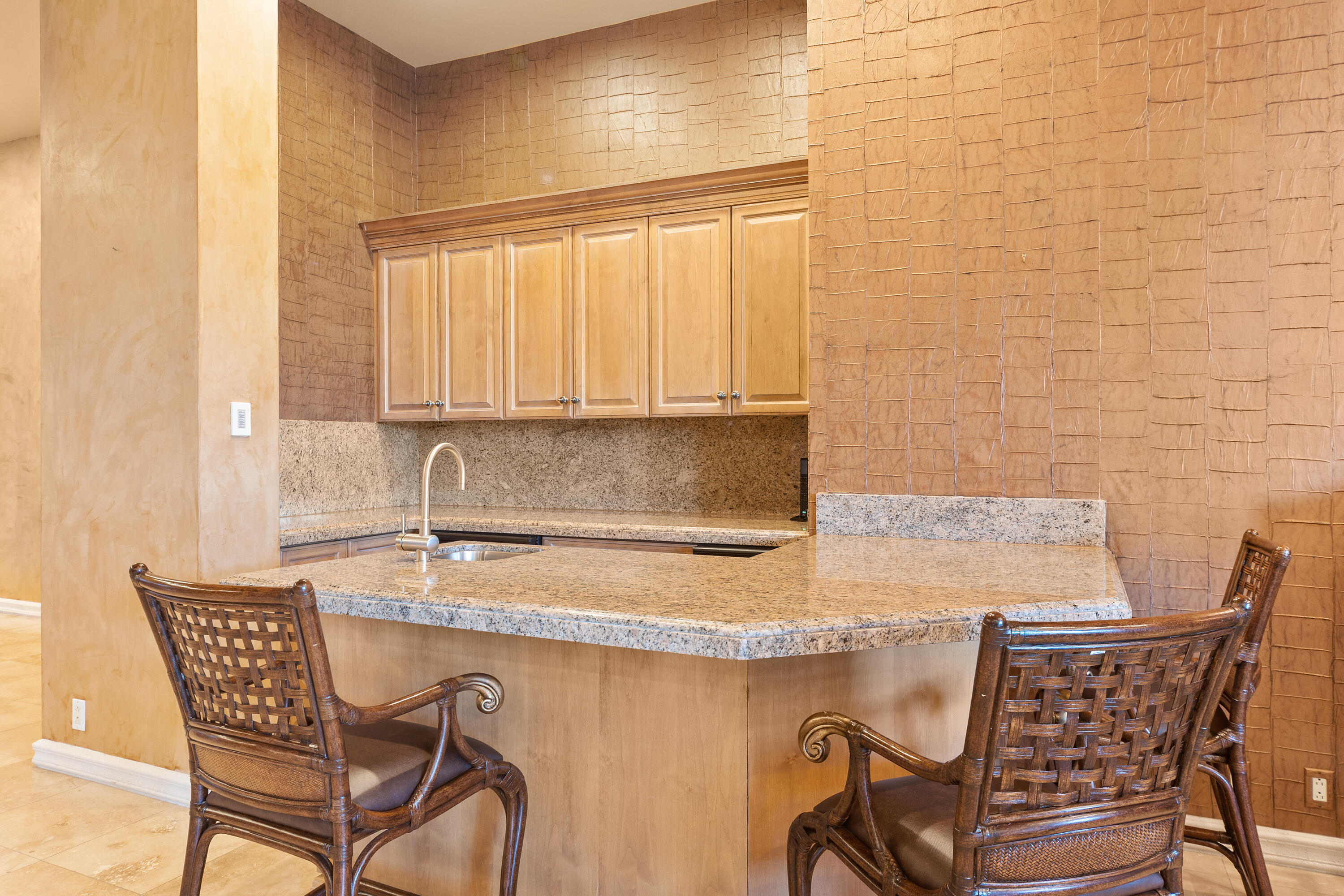 217 Via Veneto Rancho Mirage, CA 92270 - Photo 20 of 66 a kitchen with a table chairs and a sink