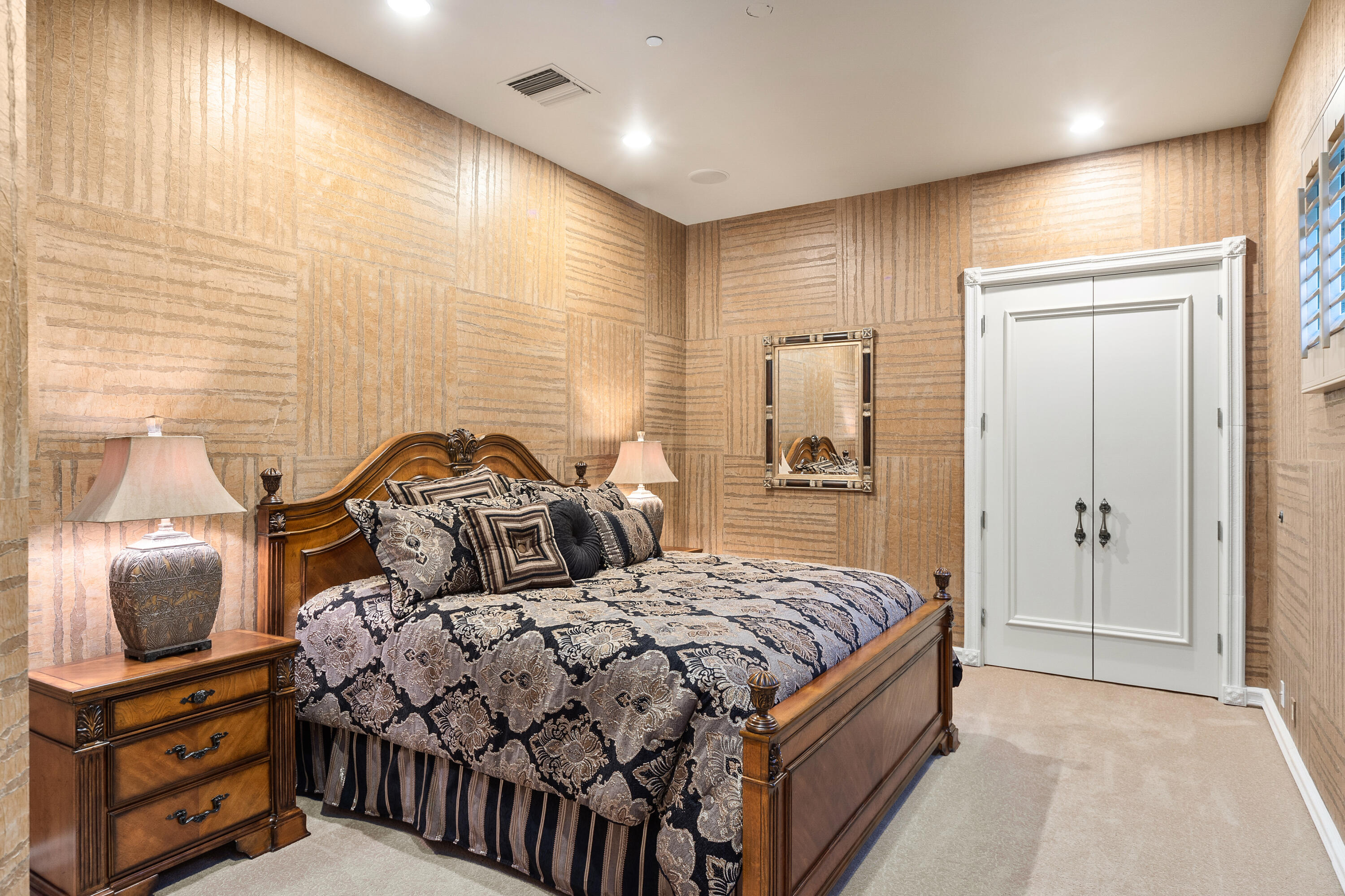 217 Via Veneto Rancho Mirage, CA 92270 - Photo 29 of 66 a bedroom with a bed and mirror