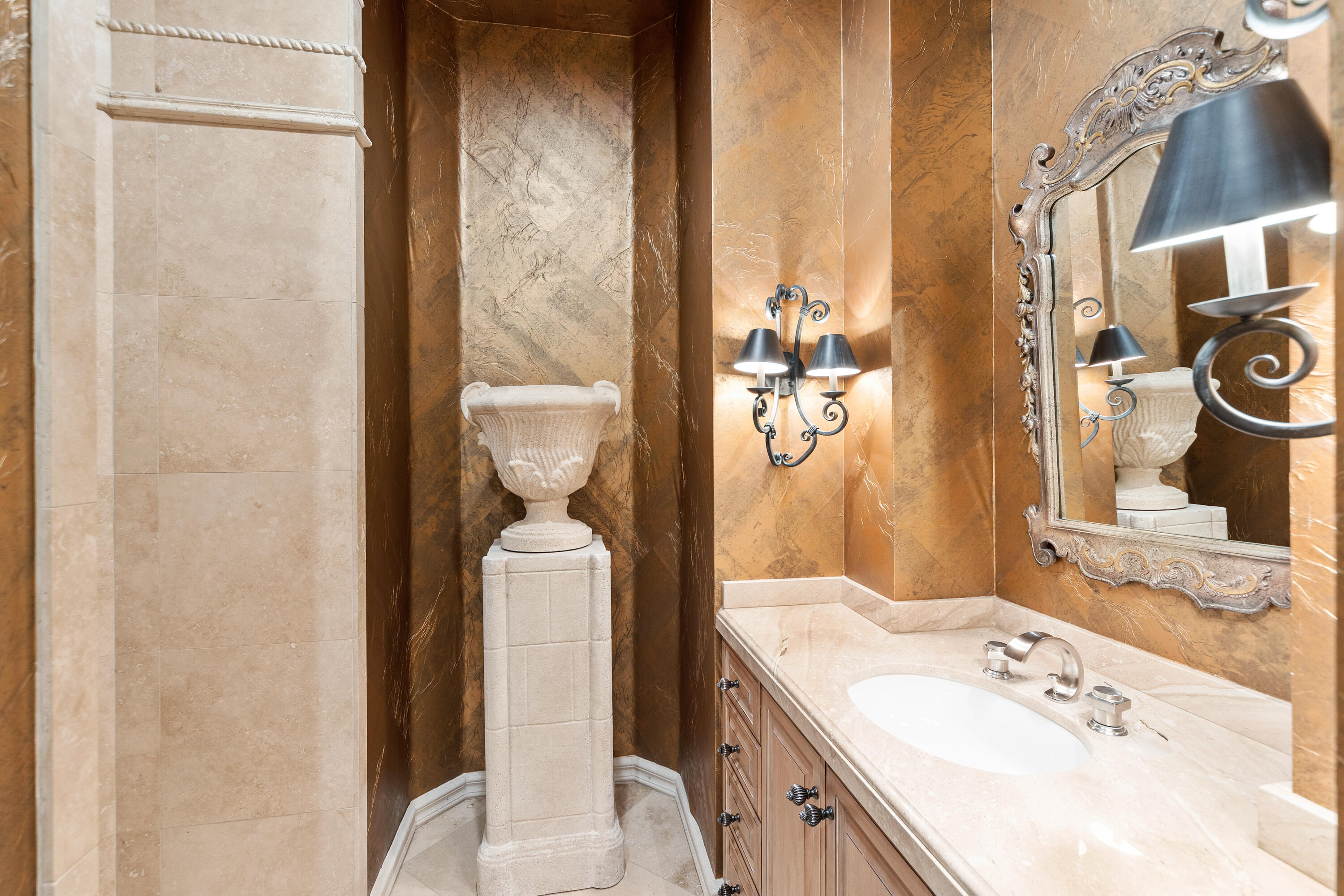 217 Via Veneto Rancho Mirage, CA 92270 - Photo 32 of 66 a bathroom with a granite countertop sink a toilet and shower