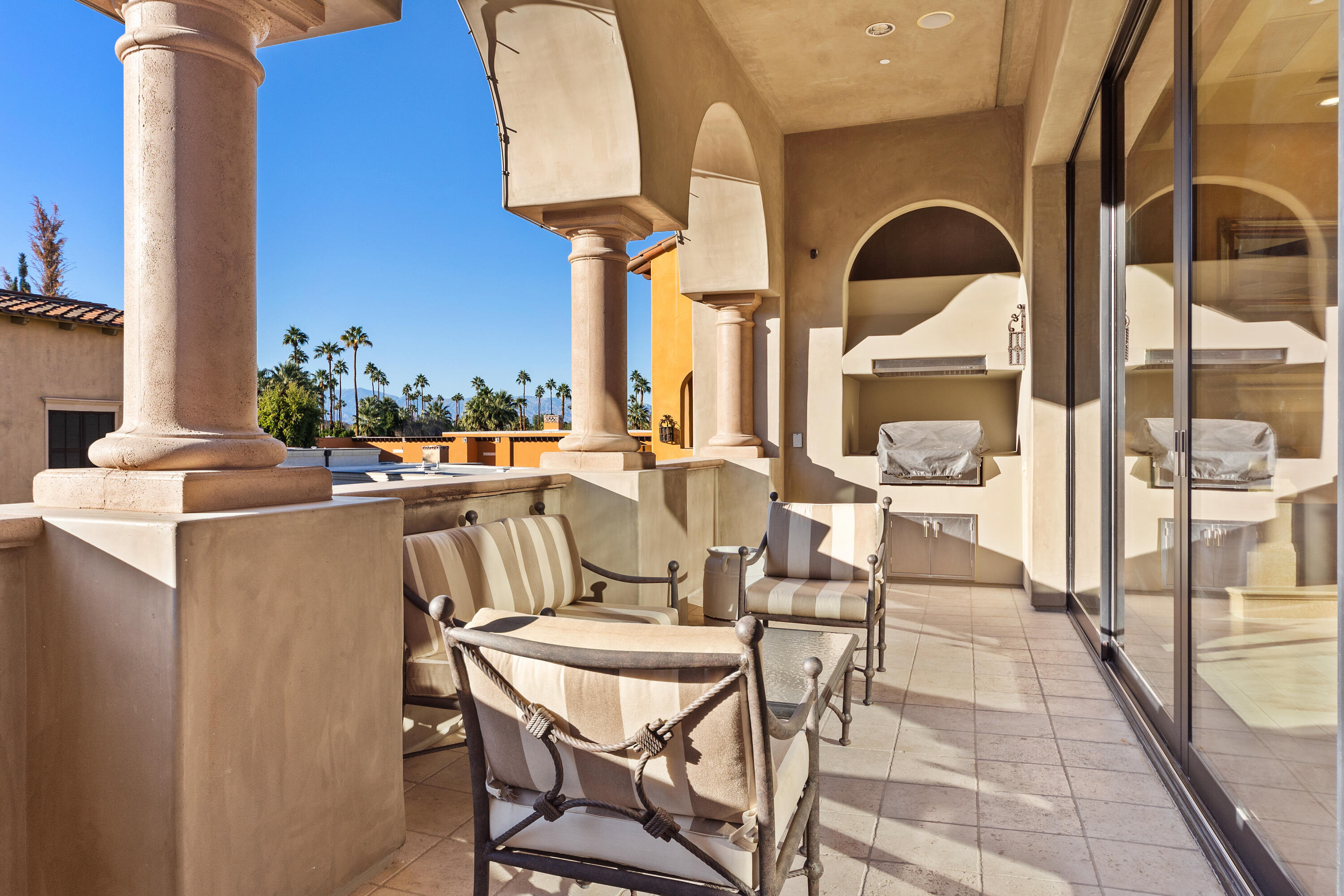 217 Via Veneto Rancho Mirage, CA 92270 - Photo 34 of 66 a dining room with furniture and a floor to ceiling window
