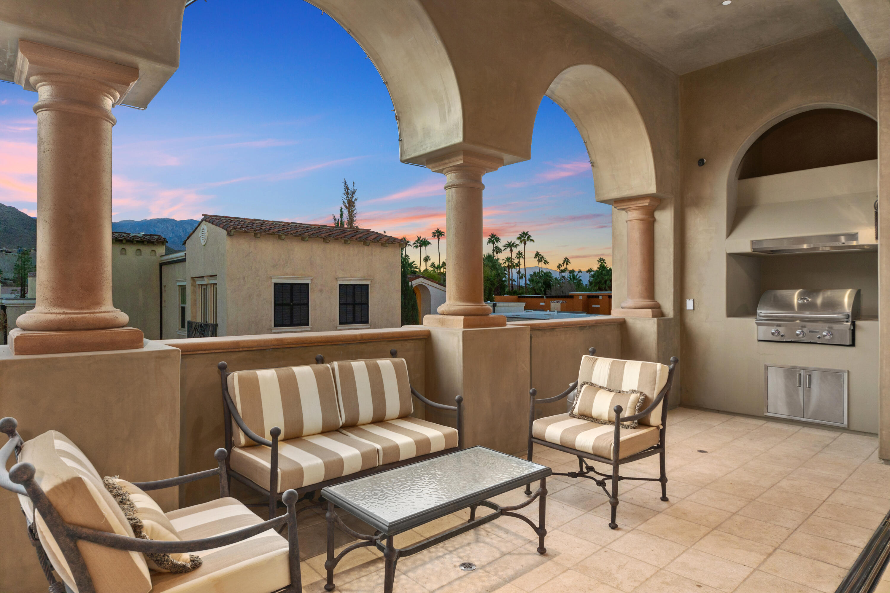 217 Via Veneto Rancho Mirage, CA 92270 - Photo 37 of 66 a balcony with table and chairs