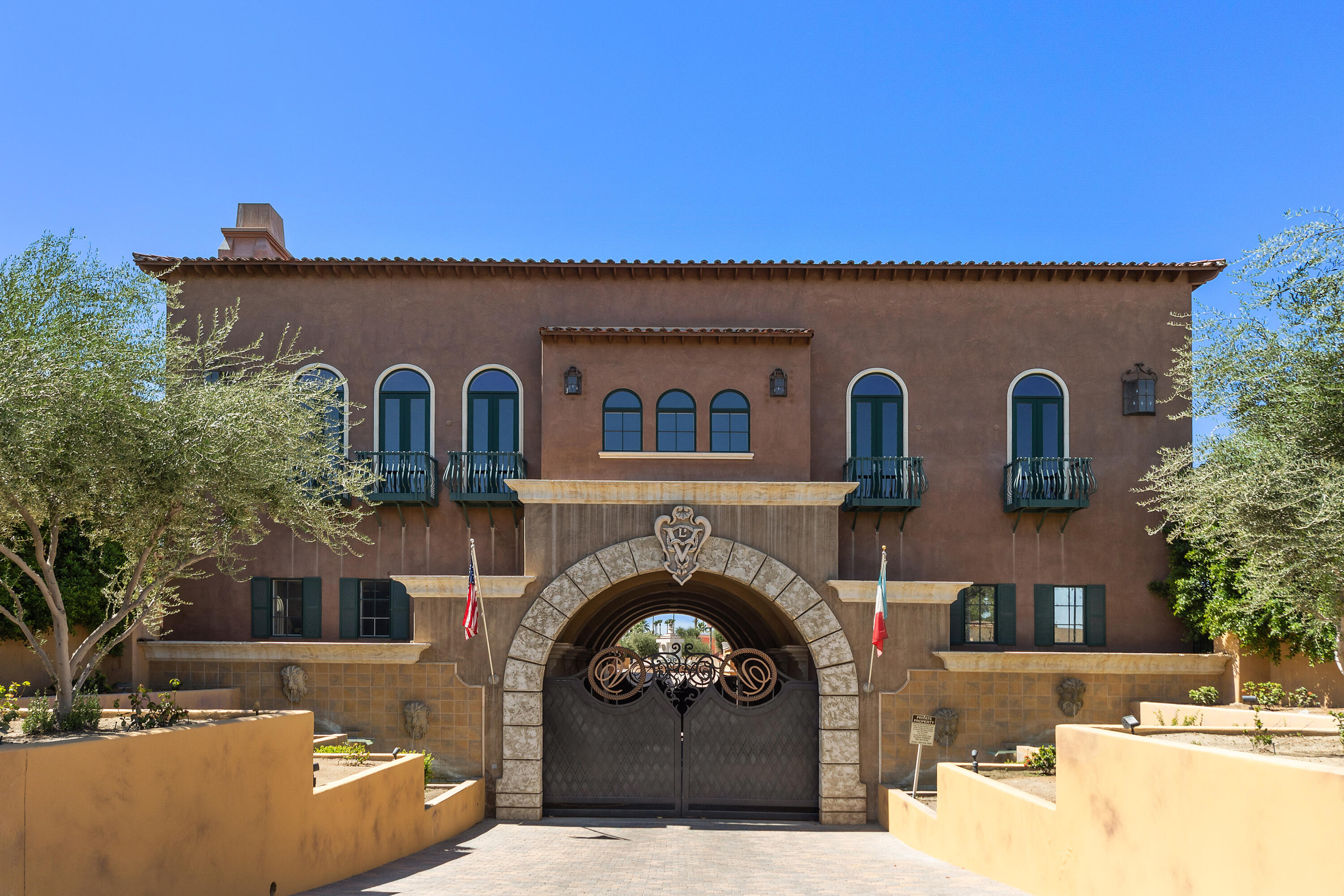 217 Via Veneto Rancho Mirage, CA 92270 - Photo 42 of 66 a front view of a house with a garden