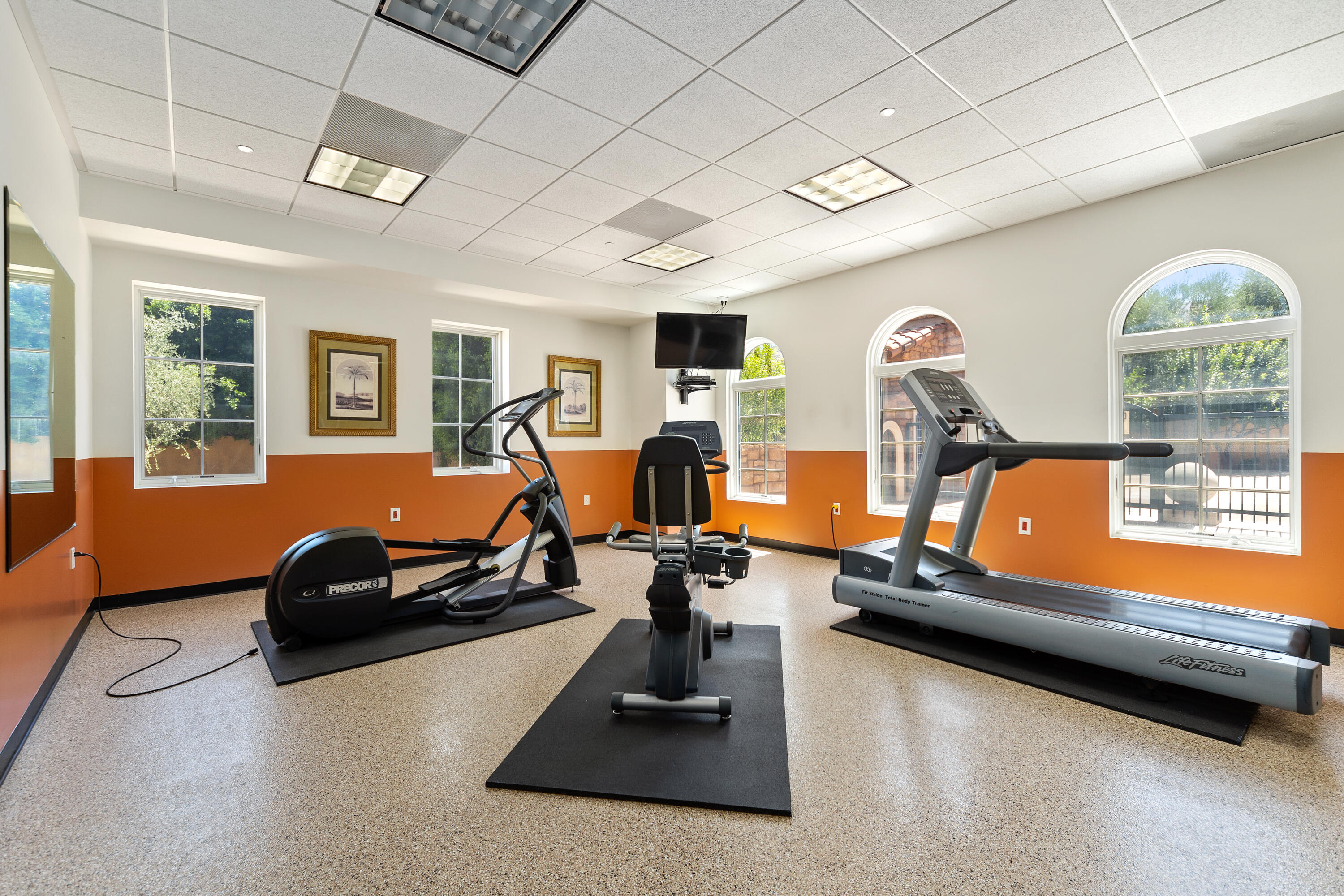 217 Via Veneto Rancho Mirage, CA 92270 - Photo 51 of 66 a room with gym equipment and a large window
