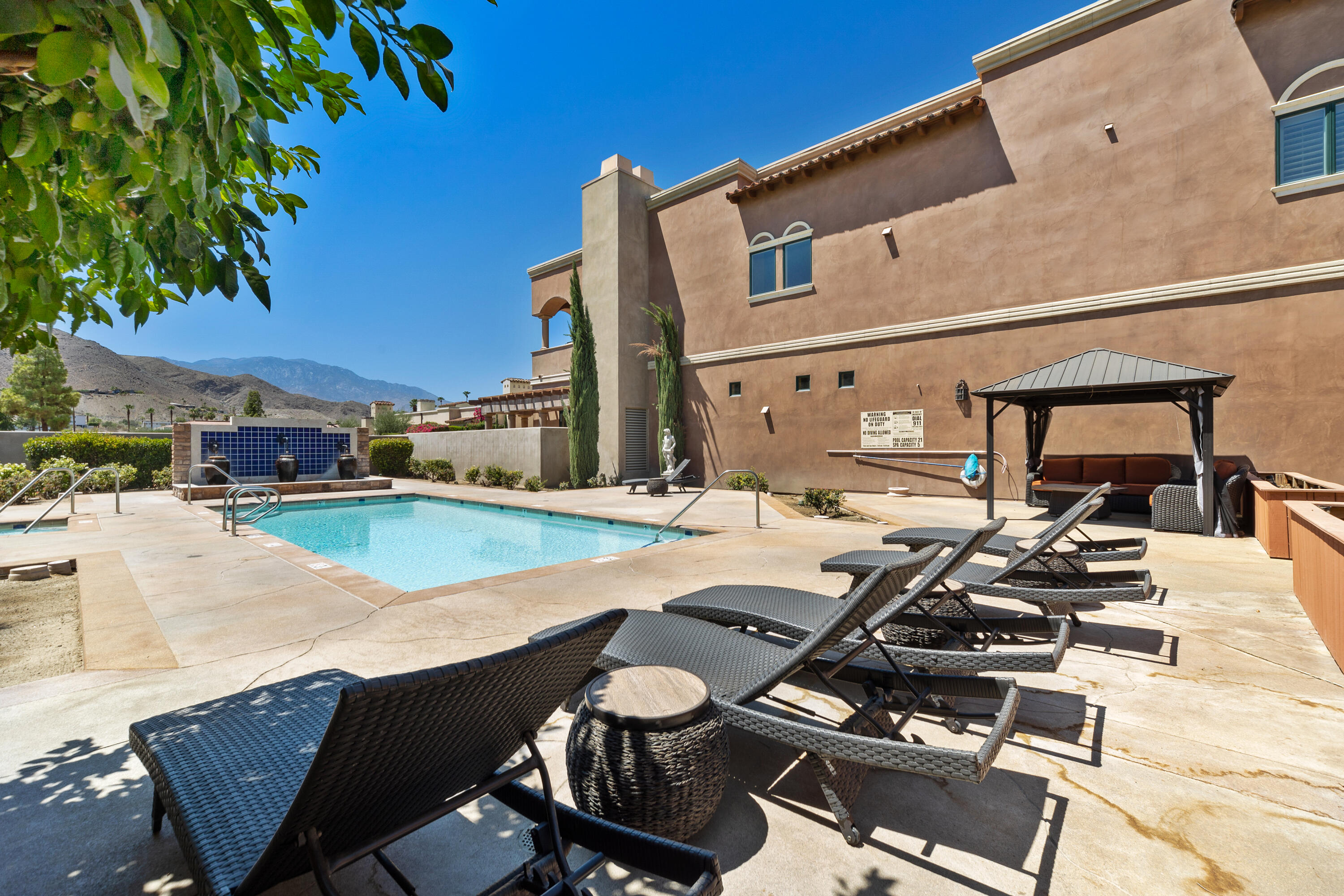 217 Via Veneto Rancho Mirage, CA 92270 - Photo 53 of 66 a view of a patio with swimming pool