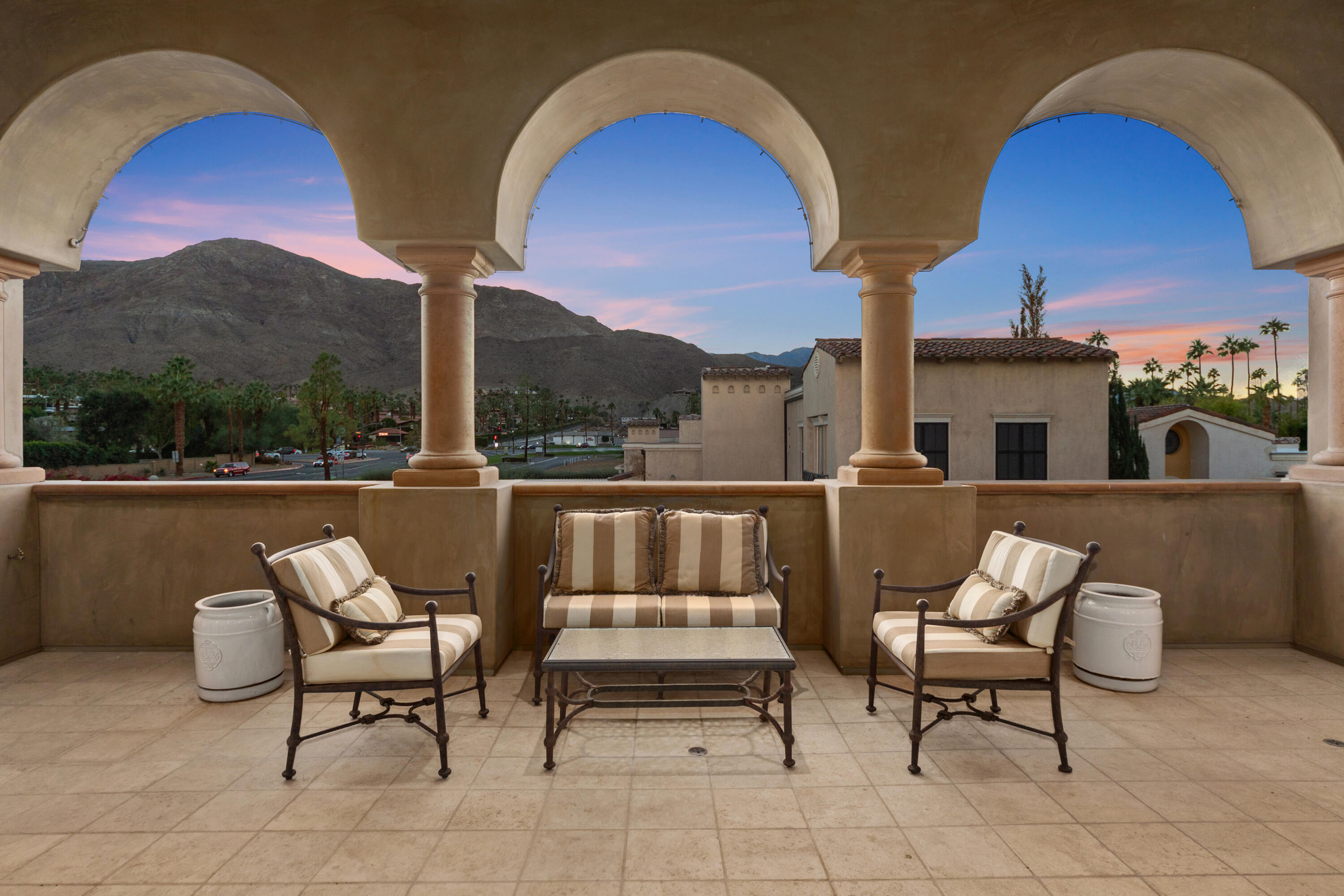 217 Via Veneto Rancho Mirage, CA 92270 - Photo 10 of 66 a balcony with table and chairs