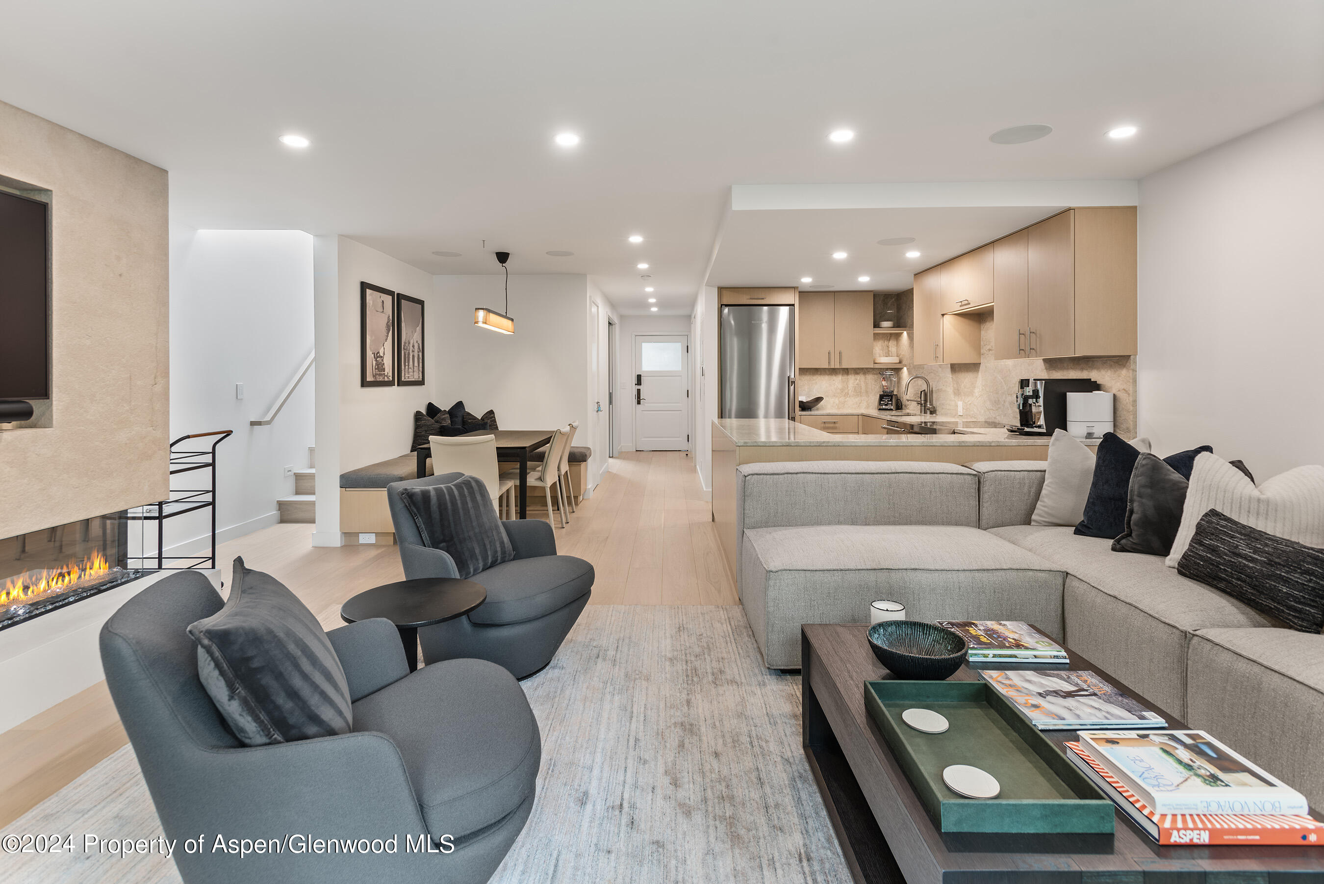 825 East Hopkins Avenue, Unit 1N Aspen, CO 81611 - Photo 16 of 16 a living room with furniture and a wooden floor
