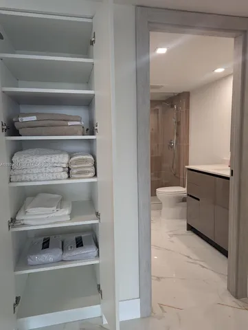 a spacious bathroom with a tub and shower