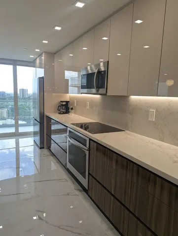 a bedroom with a bed and a view of closet