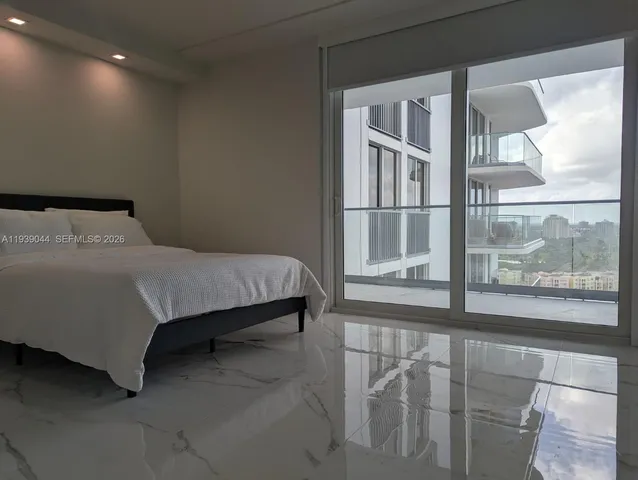 a kitchen with a sink and a refrigerator
