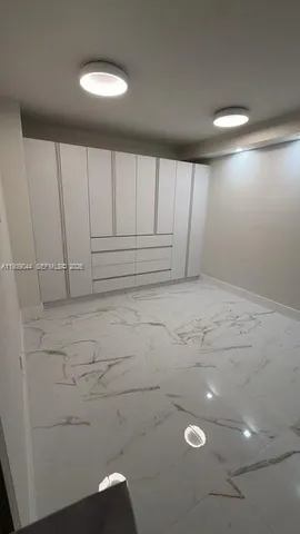 a bathroom with a toilet and shower