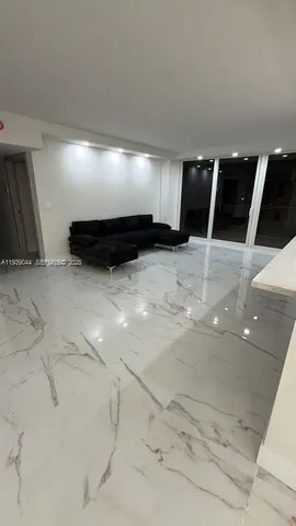 a view of an empty room with windows