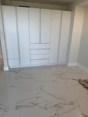 a view of a swimming pool with lounge chairs