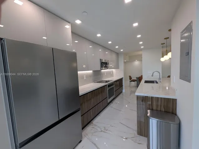 a view of a lobby with a table and chairs