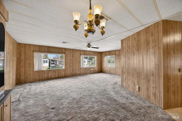 a large spacious bathroom with a granite countertop sink a toilet and shower