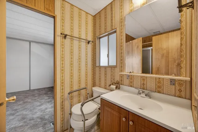 a bathroom with a glass shower door