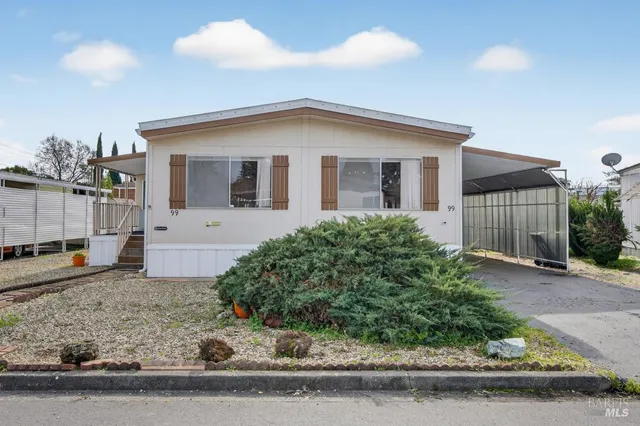 a front view of a house with garage