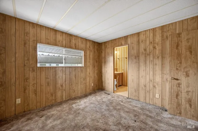 a open kitchen with stainless steel appliances granite countertop a refrigerator and a sink