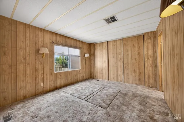 a view of a room with a wooden door