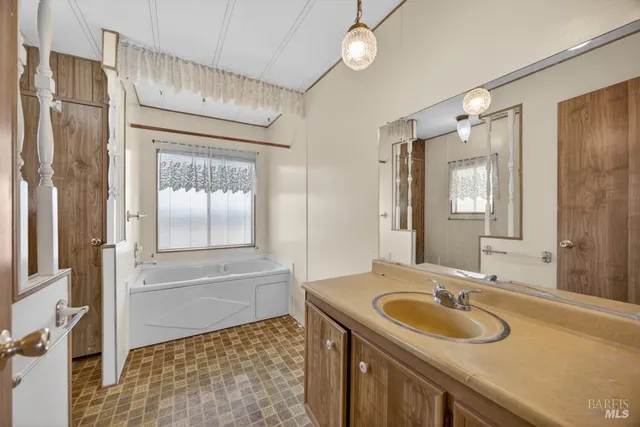 a bathroom with a tub and shower