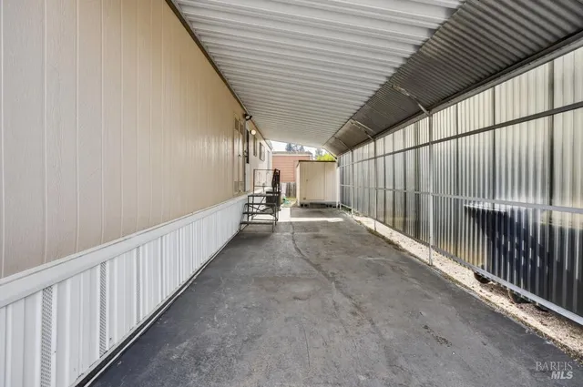 a backyard of a house with potted plants