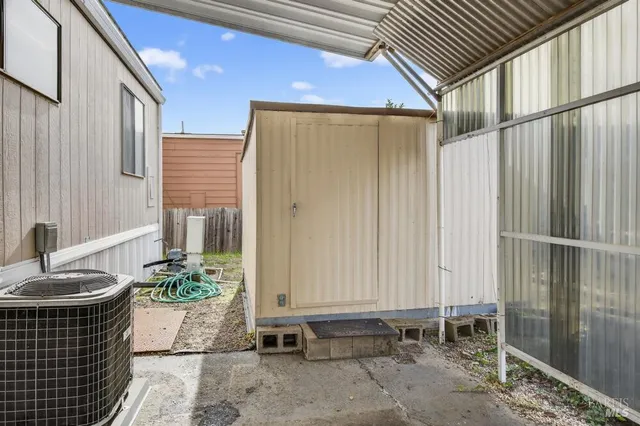 a view of house with backyard and trees