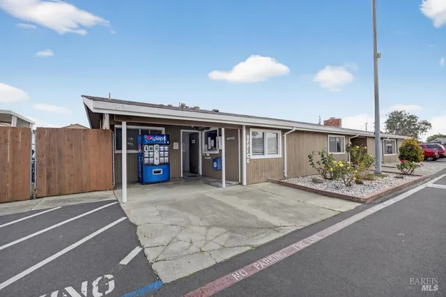 a utility room with multiple dryer and washer