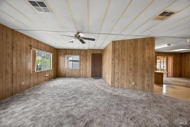 a view of entryway with wooden walls