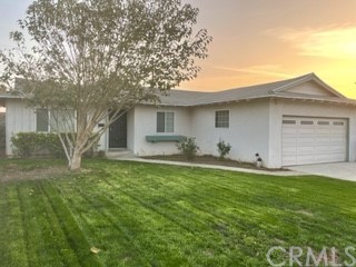 9876 Sharon Avenue Riverside, CA 92503 - Photo 1 of 1 a backyard of a house with table and chairs