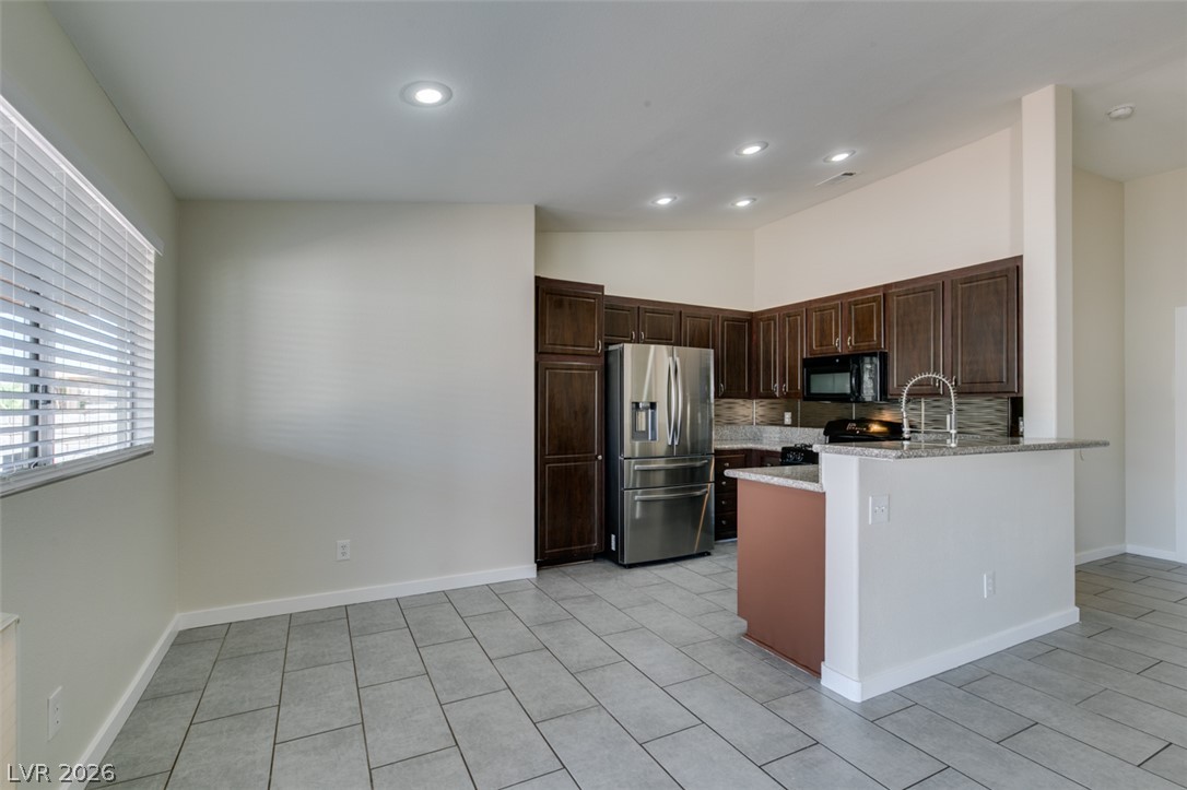 2028 Rustler Ridge Avenue North Las Vegas, NV 89031 - Photo 16 of 40 A streamlined kitchen provides ample workspace, illuminated by overhead recessed lighting.