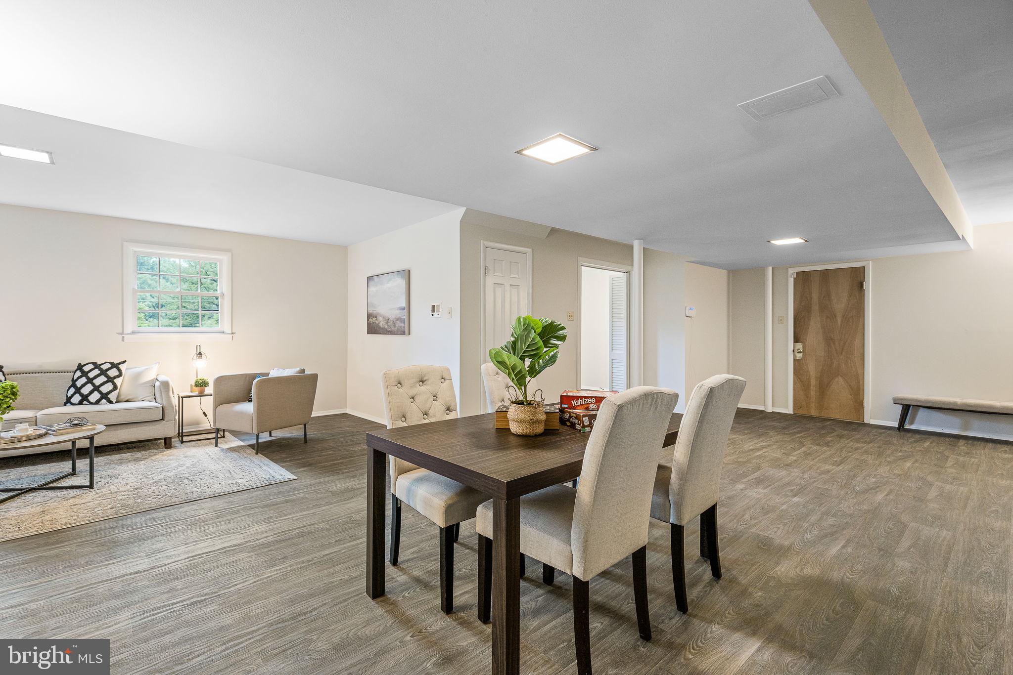 7809 Greeley Boulevard Springfield, VA 22152 - Photo 38 of 52 Expansive family room, new floors, built-ins & fp