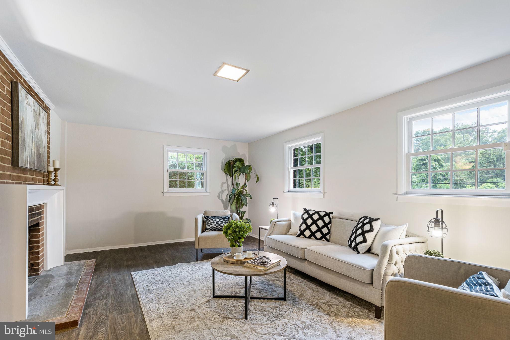 7809 Greeley Boulevard Springfield, VA 22152 - Photo 42 of 52 Expansive family room, new floors, built-ins & fp