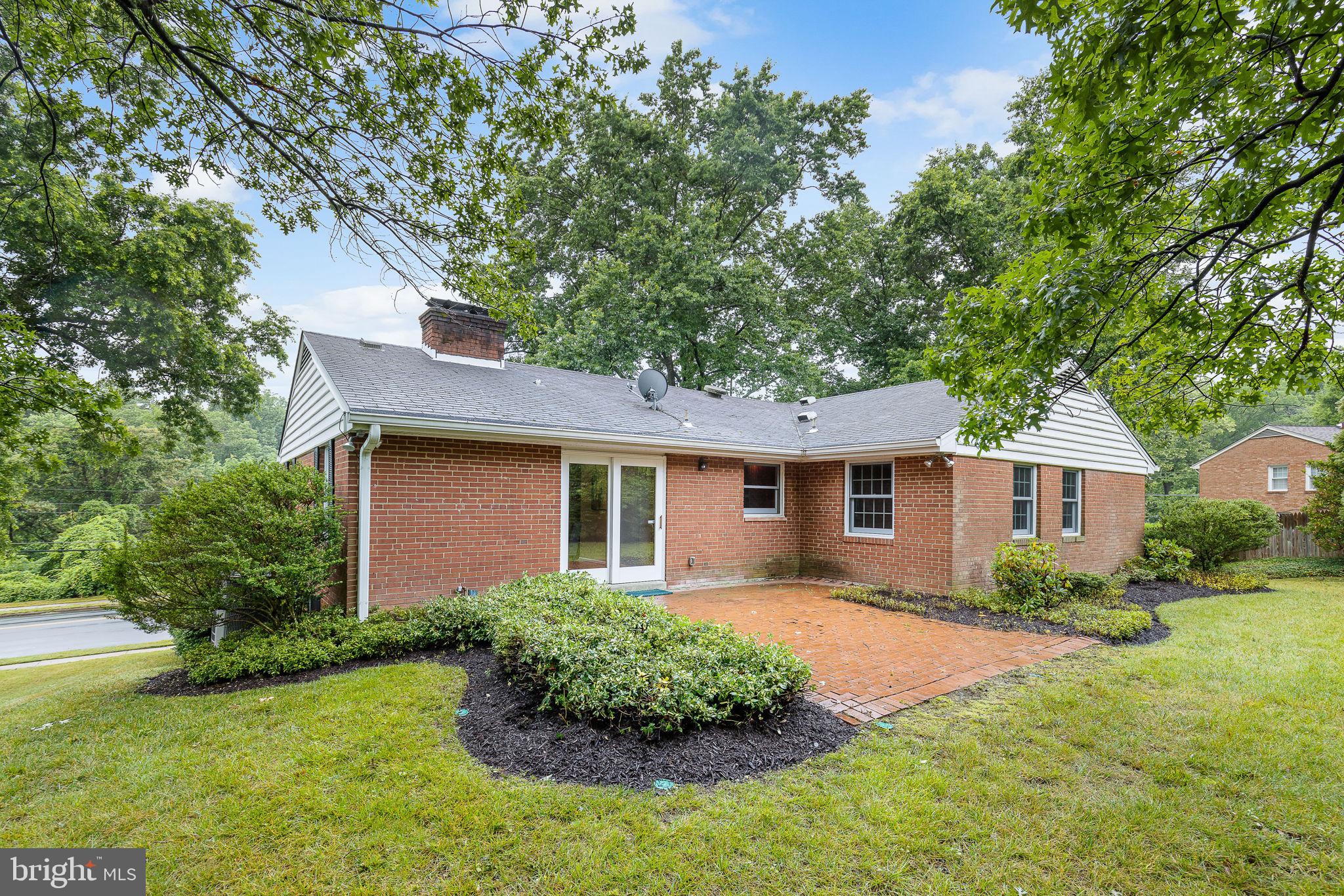 7809 Greeley Boulevard Springfield, VA 22152 - Photo 45 of 52 Partially fenced backyard w private brick patio