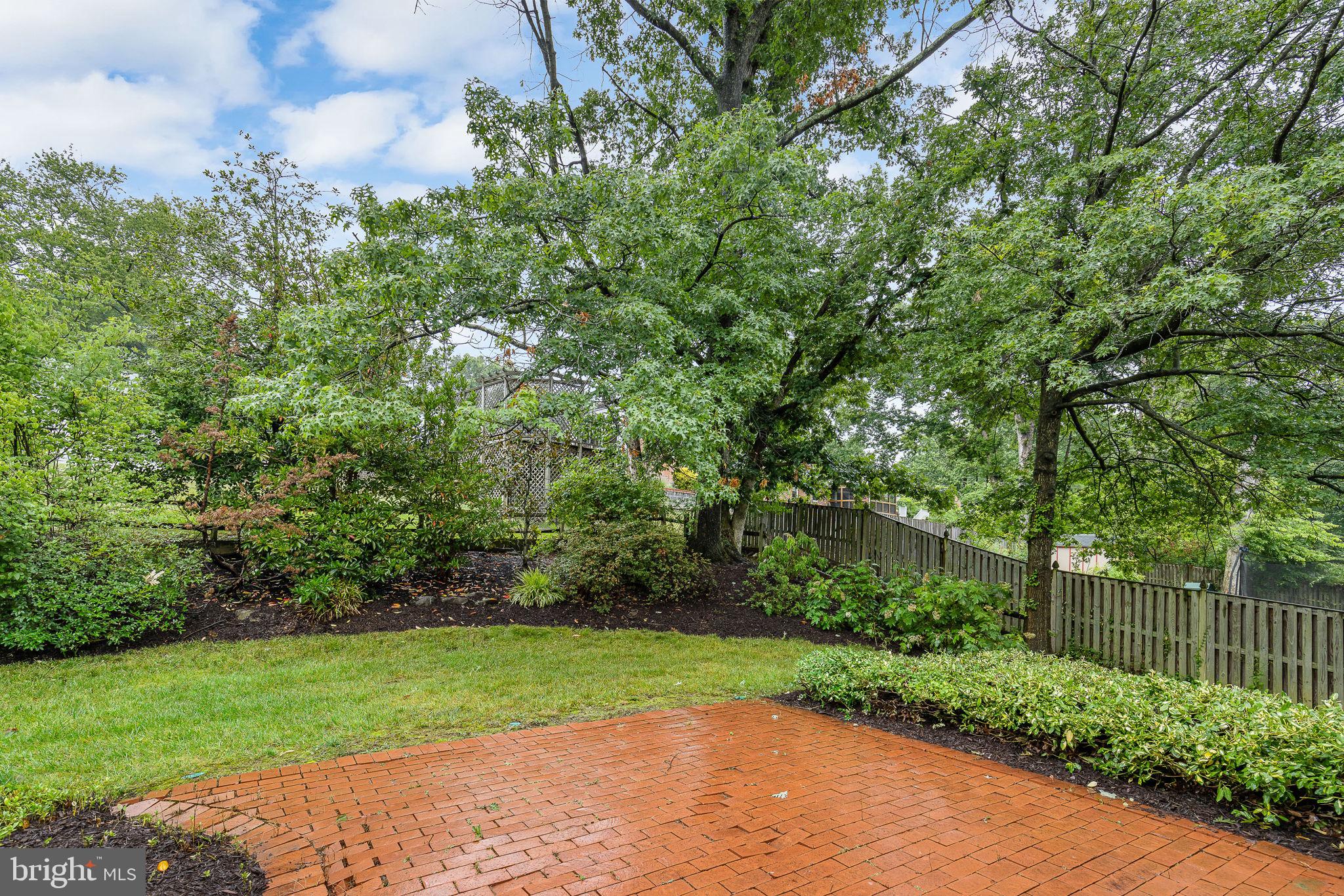 7809 Greeley Boulevard Springfield, VA 22152 - Photo 48 of 52 Partially fenced backyard w private brick patio