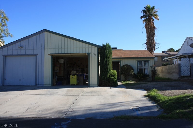 View of front of home featuring a garage and board and batten siding