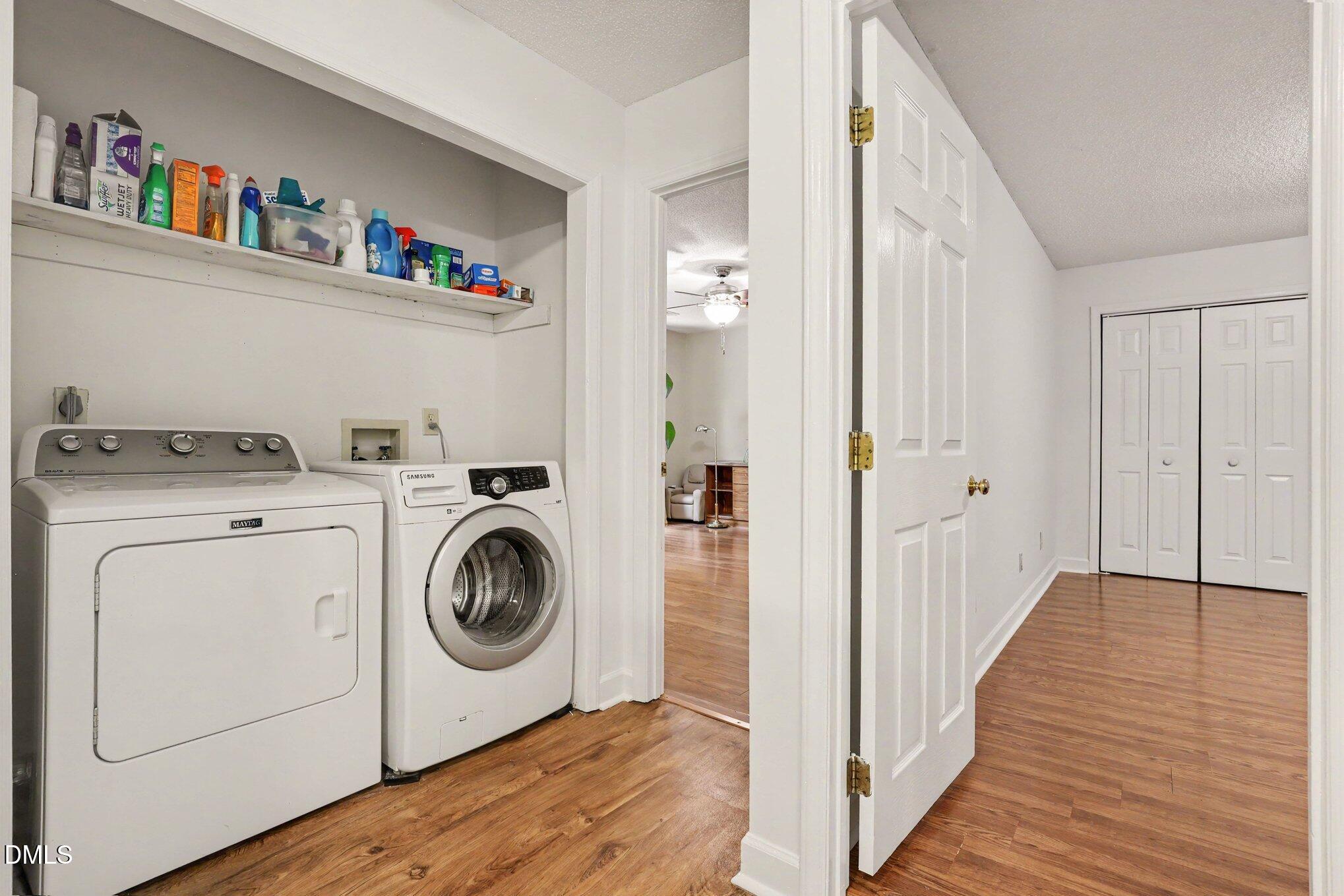 114 Oak Hollow Road Timberlake, NC 27583 - Photo 21 of 31 Dedicated laundry area featuring a white top-load washing machine and front-load dryer