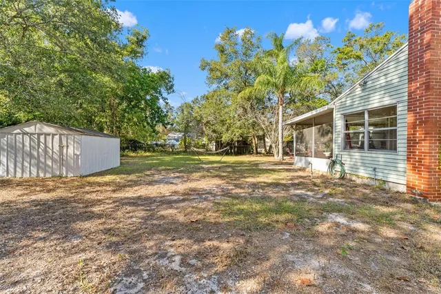 a backyard of a house with lots of green space