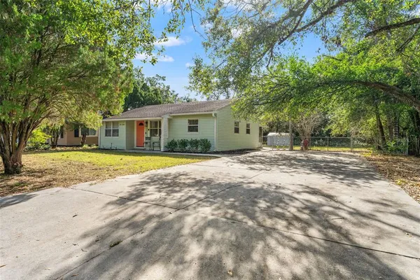 a house with trees in the background