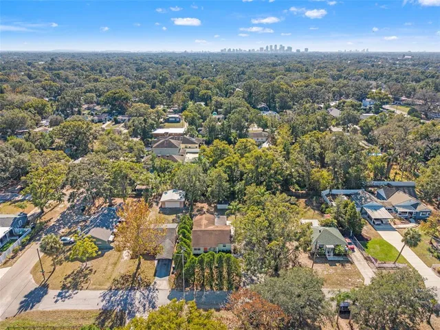 an aerial view of residential houses with yard