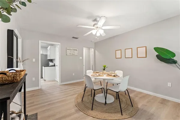 a dining room with furniture and window