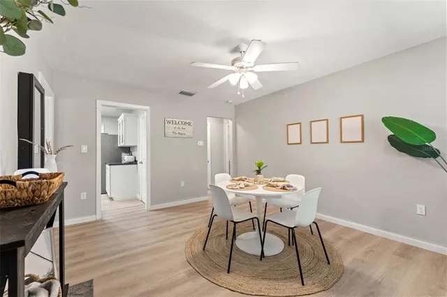 a dining room with furniture and window